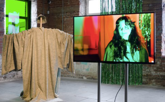 Art Gallery with sculpture and video monitor